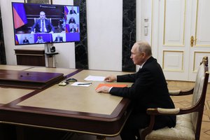 Russian President Vladimir Putin chairs a meeting with members of the Security Council via videoconference at the Kremlin in Moscow, Russia, Friday, Oct. 20, 2023