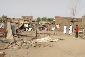 People check the rubble of their destroyed home after strikes at Allamat district in Khartoum, Sudan, Thursday, June 1, 2023.