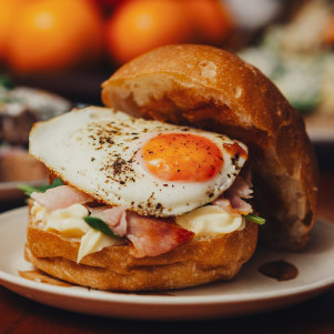 Bacon and egg roll with spinach.