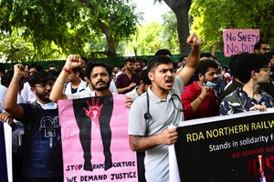 Doctors and paramedics protesting against the rape and killing of a trainee doctor at a government hospital in Kolkata gather in front of the Indian health minister's office, in New Delhi, India, Monday, Aug. 19, 2024.