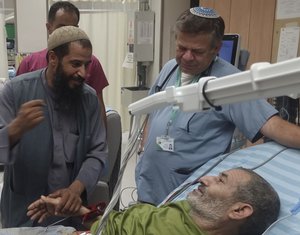 In this photo released by Soroka Medical Center on Tuesday, Aug. 27, 2024, Kaid Farhan Al-Qadi, 52, who was held hostage by Hamas militants in Gaza lies on a bed of the ‏Soroka Medical Center in Beersheba, Israel.