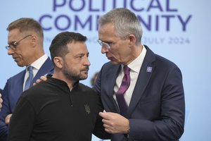 File - Ukrainian President Volodymyr Zelenskyy, left speaks to the Nato Secretary General Jens Stoltenberg before the first plenary session at the European Political Community meeting at Blenheim Palace in Woodstock, England, Thursday, July 18, 2024.