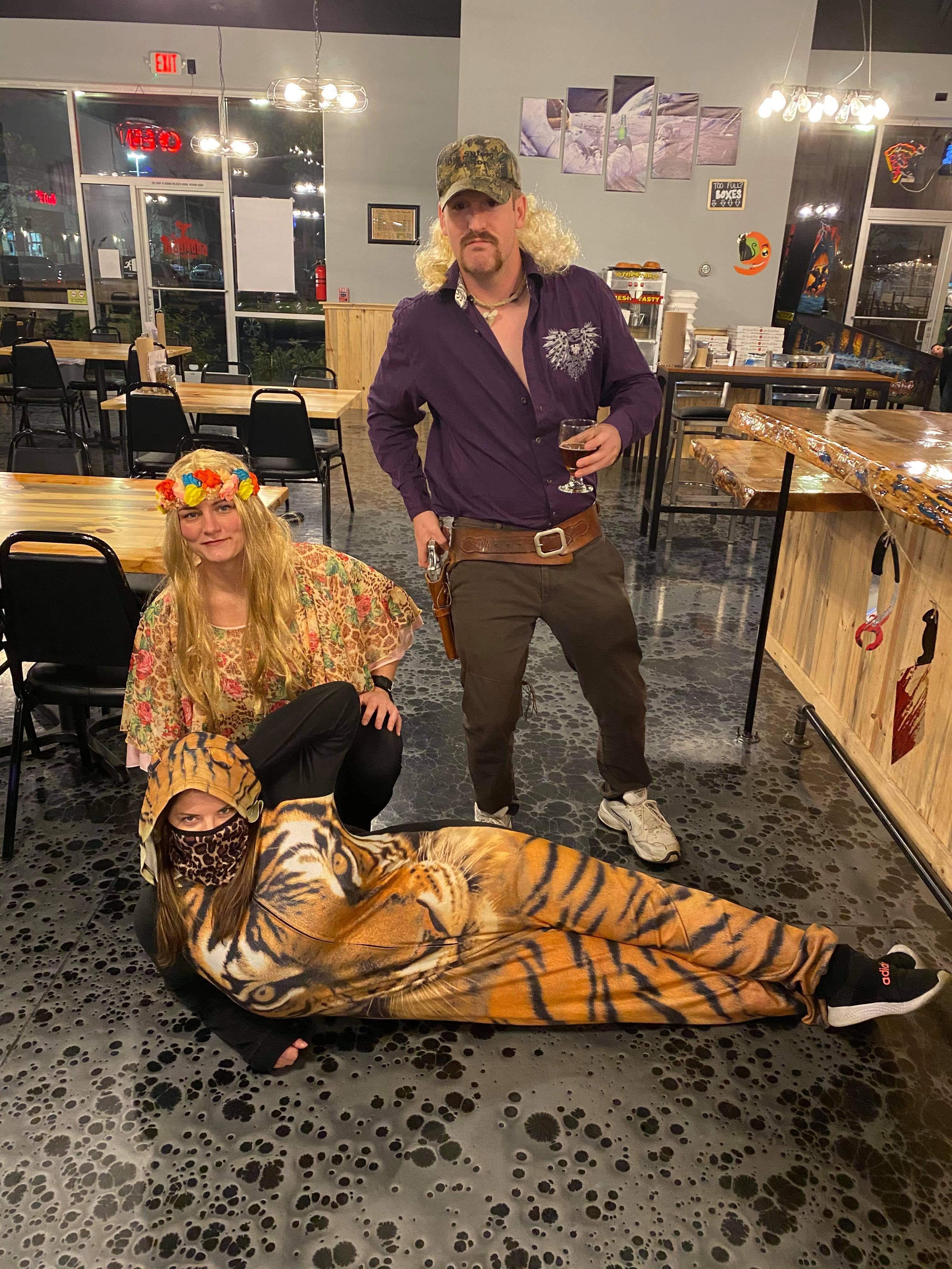 r/funny - I was working in my tiger onesie on Halloween when customers came in as Joe Exotic and Carole Baskin.