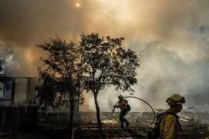 Firefighters battle the Boyles fire in Clearlake, Calif., on Sunday, Sept. 8, 2024.