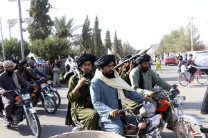 File - Taliban fighters celebrate the third anniversary of the withdrawal of US-led troops from Afghanistan, in Lashkar Gah, Helmand province, southwestern Afghanistan, Wednesday, Aug. 14, 2024.