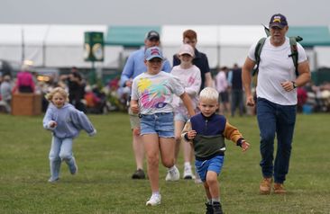 Mike Tindall with his children Mia (centre), Lena (left) and Lucas (front) at the Defender Burghley Horse Trials at Burghley House near Stamford