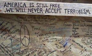  Someone wrote &quot;America is still free. We will never accept terrorism&quot; on the back of the bulletin board at a spontaneous memorial that sprang up near the Pentagon to honor those killed in the terrorist attack there Sept. 11, 2001. ula1 