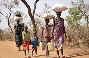 File - After walking for days, a refugee family arrives in Yida, South Sudan, Feb. 20, 2018. South Sudan's president on Wednesday, Feb. 22, 2023, urged the country's more than 2 million refugees to return home in his first meeting with displaced people since civil war erupted almost a decade ago.