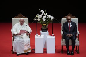 Pope Francis addresses Singapore's President Tharman Shanmugaratnam, right, and the audience during a meeting with the authorities, civil society and the diplomatic corps in the theatre of the Cultural Centre of the National University of Singapore, Thursday, Sept. 12, 2024. Pope Francis flew to Singapore on Wednesday for the final leg of his trip through Asia, arriving in one of the world's richest countries from one of its poorest after a record-setting final Mass in East Timor.