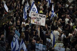 People protest against Prime Minister Benjamin Netanyahu's government and call for the release of hostages held in the Gaza Strip by the Hamas militant group, in Tel Aviv, Israel, Saturday, Sept. 14, 2024.