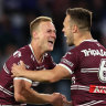 Daly Cherry-Evans celebrates with Luke Brooks.