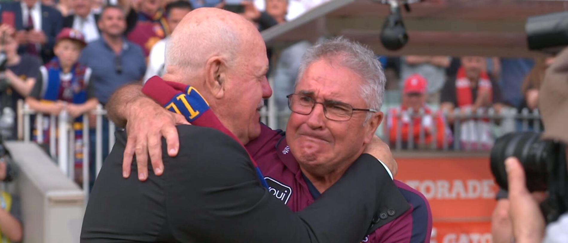 Leigh Matthews and Chris Fagan embrace after Brisbane's premiership triumph.