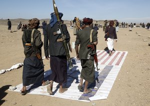 Houthi fighters attend a rally of support for the Palestinians in the Gaza Strip and against the U.S. strikes on Yemen outside Sanaa on Monday, Jan. 22, 2024.