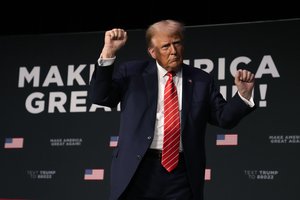 Former President Donald Trump dances on stage during a commit to caucus rally, Sunday, Oct. 29, 2023, in Sioux City, Iowa