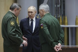 FILE - Russian President Vladimir Putin, center, talks with Russian Chief of General Staff Gen. Valery Gerasimov, left, and Russian Defense Minister Sergei Shoigu after a meeting with military leaders in Moscow, Russia, on Dec. 19, 2023. The Kremlin says Russia's President Vladimir Putin has signed a decree appointing Sergei Shoigu as secretary of Russia's national security council, replacing Nikolai Patrushev. The appointment Sunday comes after Putin proposed to appoint Andrei Belousov as the country's defense minister instead of Shoigu, who has served in the post for years.