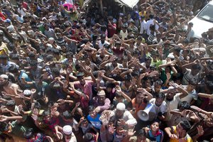 Rohingya refugees shout slogan during a protest against the repatriation process at Unchiprang refugee camp near Cox's Bazar, in Bangladesh, Thursday, Nov. 15, 2018.