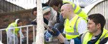 Volunteers painting bridge