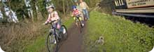 children cycling along towpath
