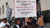 Protesters demonstrate against cuts in Detroit city workers' pensions and healthcare, outside Theodore Levin U.S. Courthouse during Detroit's bankruptcy eligibility trial in Detroit, Michigan October 28, 2013. Detroit's emergency manager Kevyn Orr painted a picture of a city in dire financial straits in testimony on Monday, with budgets so strained that bumpers were falling off police cars, as he laid out the city's case of why a municipal bankruptcy filing was the only way back to health. REUTERS/Rebecca Cook (UNITED STATES - Tags: BUSINESS EMPLOYMENT POLITICS CIVIL UNREST) - RTX14RWE