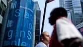 Pedestrians walk past Morgan Stanley headquarters in New York, U.S