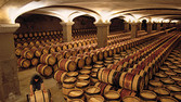 Rolling a barrel into the 2nd year chai of Chateau Margaux Margaux Gironde France Bordeaux