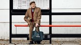 A man sits by himself at a bus stop in London October 18, 2013. Britain's Health Secretary Jeremy Hunt said in a speech at the National Children and Adults Services (NCAS) conference on Friday that it is a national shame that "there are 800,000 people in England who are chronically lonely", quoting the Campaign to End Loneliness for the figure, according to local media. REUTERS/Luke MacGregor (BRITAIN - Tags: SOCIETY HEALTH TRANSPORT) - RTX14FTY