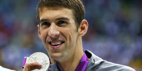 Phelps makes history in the pool