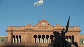 The statue of General Jose de San Martin stands in front of the government palace, known as the Pink House, in Buenos Aires, Argentina,