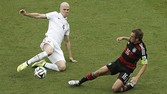 United States' Michael Bradley (4) and Germany's Philipp Lahm battle for the ball during the group G World Cup soccer match between the USA and Germany at the Arena Pernambuco in Recife, Brazil, Thursday, June 26, 2014. (AP Photo/Hassan Ammar)