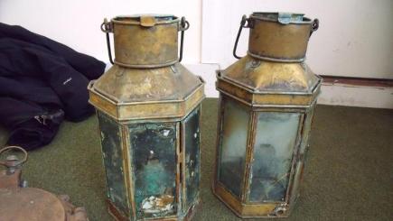 Lanterns recovered by the Maritime and Coastguard Agency from two divers, David Knight and Edward Huzzey, who have been ordered to pay a total of £63,500 in fines and costs for salvaging items (MCA/PA)