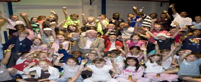 Children celebrating with hands in the air