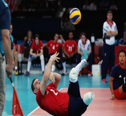 Justin Phillips of Great Britain plays a shot during the Men's Sitting Volleyball 7-8 Clasification match against Brazil on day 8 of the London 2012 Paralympic Games at ExCel.