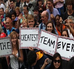 The crowd displays signs of 'Our Greatest Team' during the celebratory Team GB Athletes Parade in London after the successful London 2012 Olympic and Paralympic campaign.