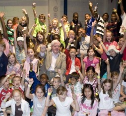 Children celebrating with hands in the air