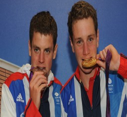 Alistair and Jonathan Brownlee of Great Britain celebrate winning Olympic medals at the London 2012 Olympic Games.