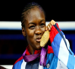 Nicola Adams celebrates by kissing her Gold medal as she becomes the first female Olympic Boxing Champion at the London 2012 Olympic Games.