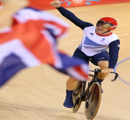 Sir Chris Hoy of Great Britain celebrates after setting a new world record and winning gold in the Men's Team Sprint Track Cycling final on Day 6 of the London 2012 Olympic Games at the Velodrome.