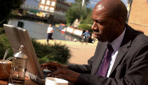 Using a laptop by the Grand Union Canal in Apsley