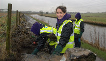 Volunteer building a dry stone wall on the Leeds & Liverpool Canal