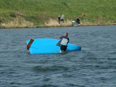 capsized sailing dinghy