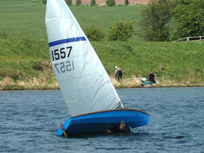 capsized sailing dinghy