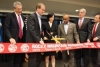 Acting Deputy Secretary of Commerce Bruce Andrews (L) is joined by Senator Bennet, Deputy USPTO Director Lee, Mayor Hancock and others at the ribbon cutting for the USPTO&#039;s Denver office