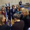 Secretary of Commerce Penny Pritzker huddles with 10 female U.S. Ambassadors at the 2015 SelectUSA Investment Summit. 