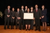 The USPTO team holding their award aside Deputy Secretary Andrews.