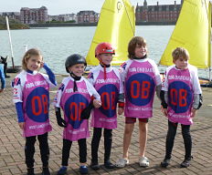 Young OnBoard sailors on quay