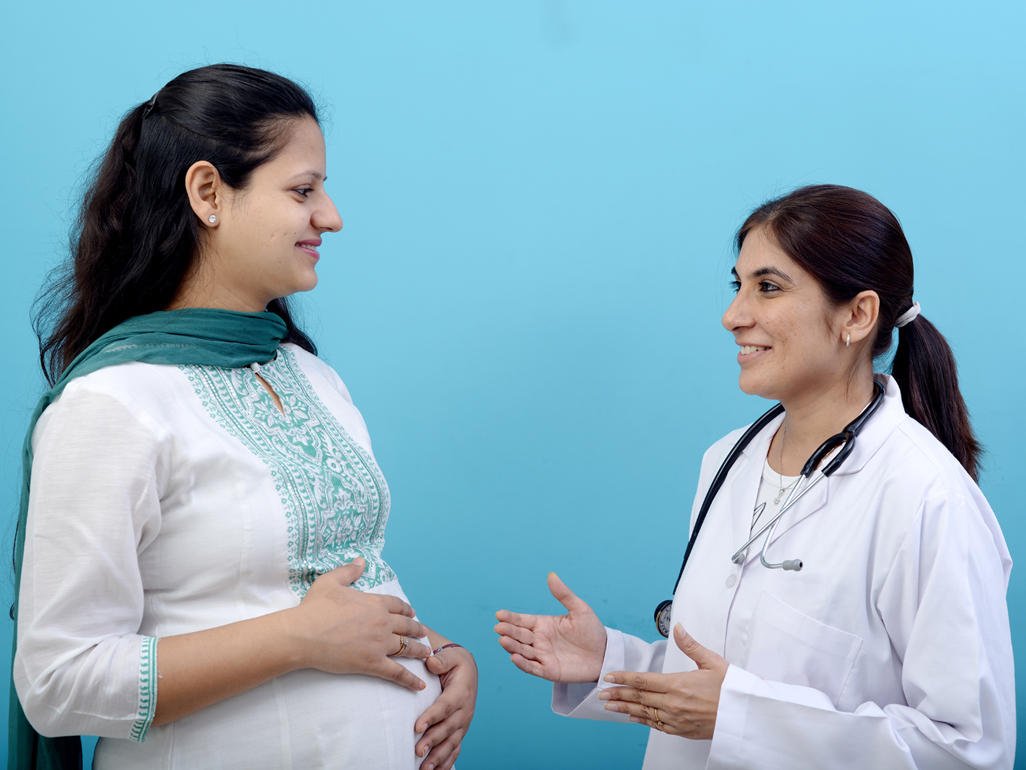 pregnant woman with doctor