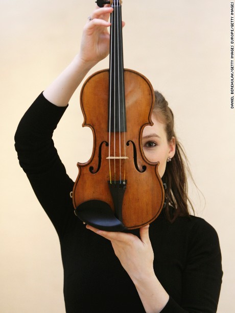 LONDON - MARCH 07:  Royal Philharmonic Orchestra violinist, Tamsin Waley-Cohen holds &#39;The Penny&#39;  Stradivari violin at Christies Austion House on March 7, 2008 in London, England. The violin made in Cremona, Italy by Antonio Stradivari, circa 1700, is expected to fetch GBP ?1,000,000 - ?1,500,000 at the Christies Fine Musical Instruments Auction on Apri 4, 2008.