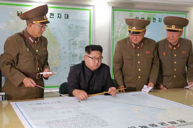 North Korea to hold off on Guam missile strike, reports say