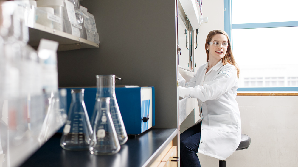 A researcher works in the lab at the UCSF Helen Diller Comprehensive Cancer Center