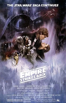 . This poster shows a montage of scenes from the movie. Dominating the background is the dark visage of Darth Vader; in the foreground, Luke Skywalker sits astride a tauntaun; Han Solo and Princess Leia gaze at each other while in a romantic embrace; Chewbacca, R2-D2, and C-3PO round out the montage.